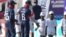 Members of the U.S. cricket team greet boys at Takashinga Cricket. Club in Highfields, June, 18, 2023. Takashinga Cricket Club, set in one of the country's oldest Black townships, hosted an international game for the first time. 