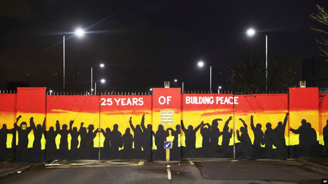 A mural on the peace gates at Lanark Way celebrates the Good Friday Agreement, in west Belfast, April 5, 2023. 