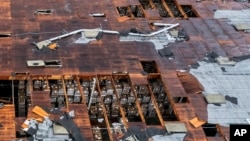 Damage to a building is seen following a tornado, in Montebello, California, March 22, 2023.