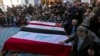 Iraqis at the Imam Ali shrine in Najaf attend the funeral of Popular Mobilization Forces fighters killed in U.S. airstrikes, Feb. 4, 2024.