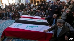 Iraqis at the Imam Ali shrine in Najaf attend the funeral of Popular Mobilization Forces fighters killed in U.S. airstrikes, Feb. 4, 2024.