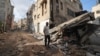 Residents inspect the damage at the Nur Shams refugee camp in the northern city of Tulkarm in the occupied West Bank, Sept. 24, 2023, following an Israeli raid.