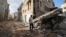 Residents inspect the damage at the Nur Shams refugee camp in the northern city of Tulkarm in the occupied West Bank, Sept. 24, 2023, following an Israeli raid.
