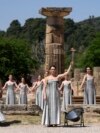 Performers take part in the final dress rehearsal of the flame lighting ceremony for the Paris Olympics, at the Ancient Olympia site, Greece, April 15, 2024. 