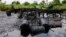 FILE- An abandoned illegal oil refinery is seen after it was raided by the Nigerian navy at Bayelsa, Nigeria, May 18, 2013. Nigerian officials have said the country loses $700 million every month as a result of oil thefts.