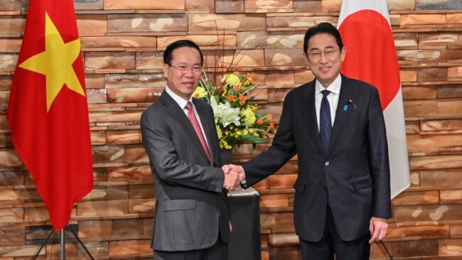 FILE - Vietnam's President Vo Van Thuong, left, is welcomed by Japan's Prime Minister Fumio Kishida during his visit to Japan, at the prime minister's official residence in Tokyo, Nov. 27, 2023.