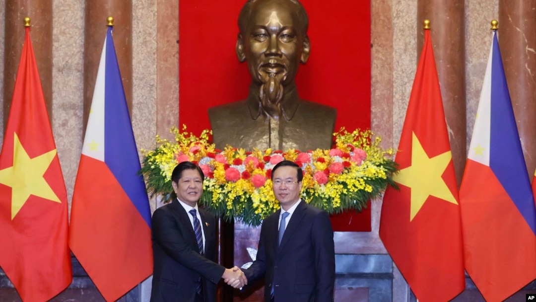 Philippine President Ferdinand Marcos Jr., left, and Vietnamese President Vo Van Thuong shake hands before a meeting in Hanoi, Vietnam, Jan. 30, 2024. 