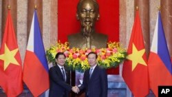 Philippine President Ferdinand Marcos Jr., left, and Vietnamese President Vo Van Thuong shake hands before a meeting in Hanoi, Vietnam, Jan. 30, 2024. 