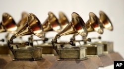 FILE - Grammy Awards are displayed at the Grammy Museum Experience at Prudential Center in Newark, NJ on Oct. 10, 2017. 
