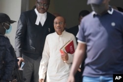 Godwin Emefiele, suspended Central Bank governor, leaves after a court hearing at the Federal High Court in Lagos, Nigeria, July 25, 2023.