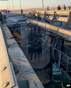 This photo released by Ostorozhno Novosti on July 17, 2023, reportedly shows damaged parts of an automobile link of the Crimean Bridge connecting Russian mainland and Crimean peninsula over the Kerch Strait not far from Kerch, Crimea.