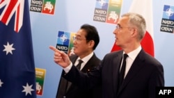 NATO Secretary-General Jens Stoltenberg welcomes Japan's Prime Minister Fumio Kishida prior to a meeting of the North Atlantic Council with Asia-Pacific partners during the NATO summit in Vilnius, Lithuania, July 12, 2023.