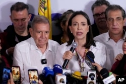 Opposition leader Maria Corina Machado, right, and presidential candidate Edmundo Gonzalez hold a press conference in Caracas, Venezuela, July 29, 2024.