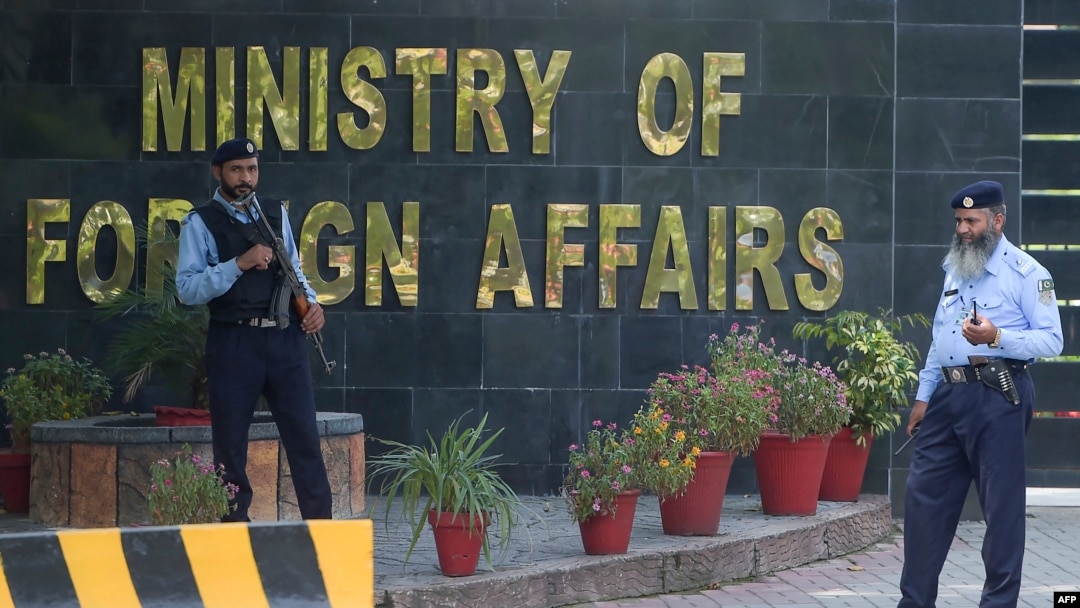 FILE - Pakistani policemen stand guard outside the Pakistan's Foreign Ministry building in Islamabad, Sept. 2, 2019.