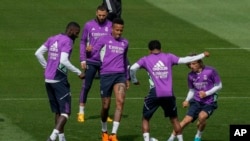 Real Madrid players play the ball during a training session in Madrid, May 23, 2023. Spanish police say four people suspected of hanging an effigy of Real Madrid player Vinícius Júnior off a highway bridge in Madrid have been arrested.