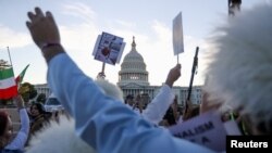 Supporters of women's rights in Iran march on the anniversary of the death of Mahsa Amini during a protest outside the Capitol in Washington, Sept. 16, 2023.