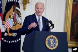 President Joe Biden delivers remarks about government regulations on artificial intelligence systems during an event in the East Room of the White House, Oct. 30, 2023.