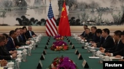 Dr. Rahul Gupta, head of the White House's Office of National Drug Control Policy, leads a delegation in talks with the Chinese side led by Chinese Minister of Public Security Wang Xiaohong, Beijing, China, June 20, 2024. 