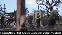 Members of the Hawaii National Guard assist Maui County and state officials in the search and recovery efforts after wildfires devastated the historic town of Lahaina on the island of Maui in the U.S. state of Hawaii, Aug. 10, 2023.