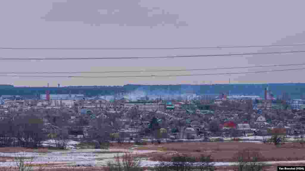 Smoke rises after the east side of Kupiansk was hit by grad rockets fired by Russian troops, just 20 km away, Feb. 16, 2023.