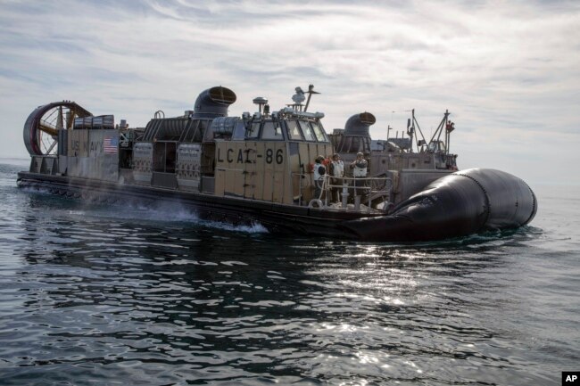 In this image provided by the U.S. Navy, sailors operate landing craft air cushions (LCAC) during recovery efforts of debris from a Chinese high altitude balloon in the Atlantic Ocean on Feb. 8, 2023. (Eric Moser/U.S. Navy via AP)