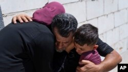 Mourners cry after taking a last look at the body of Qusai Matan during his funeral in the West Bank village of Burqa on Aug. 5, 2023. The Palestinian Health Ministry said that armed Israeli settlers shot and killed the 19-year-old.