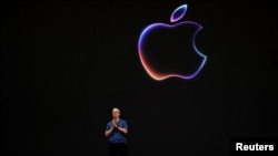 Apple CEO Tim Cook speaks at the annual developer conference event at the company's headquarters in Cupertino, California, June 10, 2024.