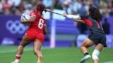 Charity Williams of Canada is tackled by Xiaoqian Liu of China during the women's Rugby Sevens pool A match between Canada and China at the 2024 Summer Olympics in the Stade de France, France, July 29, 2024.