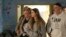 FILE - This photo provided by GPO on Dec. 1, 2023, shows hostage Mia Schem, foreground center, reuniting with her family at Sheba Medical Center in Tel Hashomer, Ramat Gan, Israel. 