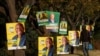 A man walks past election posters of the ruling African National Congress (ANC), as South Africa prepares for the May 29 general elections, in Soweto, May 24, 2024. 