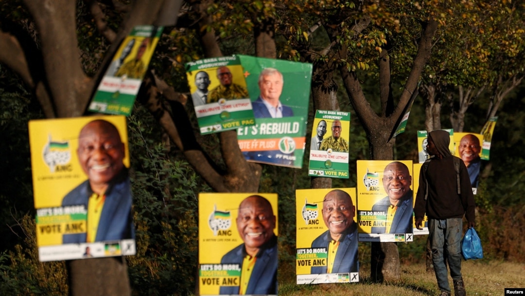 A man walks past election posters of the ruling African National Congress (ANC), as South Africa prepares for the May 29 general elections, in Soweto, May 24, 2024. 
