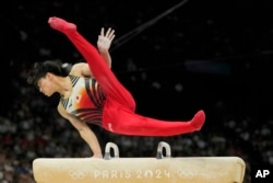 Japan's Daiki Hashimoto competes on the pommel horse during the men's artistic gymnastics team finals round at Bercy Arena at the 2024 Summer Olympics, July 29, 2024, in Paris.