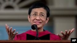 FILE - Keynote speaker Maria Ressa, a journalist and advocate for freedom of the press, addresses graduates in Harvard Yard during commencement at Harvard University, May 23, 2024, in Cambridge, Massachusetts.