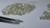 FILE - Diamonds are displayed during a visit to the De Beers Global Sightholder Sales (GSS) in Gaborone, Botswana, Nov. 24, 2015. 