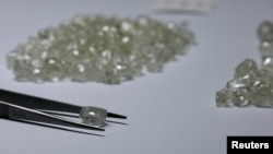 FILE - Diamonds are displayed during a visit to the De Beers Global Sightholder Sales (GSS) in Gaborone, Botswana, November 24, 2015. 