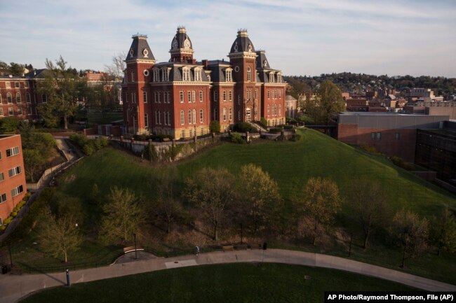 FILE - Woodburn Hall on West Virginia University's downtown campus is shown April 24, 2015, in Morgantown, W. Virginia. (AP Photo/Raymond Thompson, File)