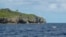 FILE - A tail of a humpback whale breaks the water in Niue in this 2018 photo. The tiny Pacific island nation of Niue has come up with a novel plan to protect its vast and pristine territorial waters — it will get sponsors to pay.