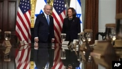 Vice President Kamala Harris, right, and Israeli Prime Minister Benjamin Netanyahu appear before a meeting at the Eisenhower Executive Office Building in Washington, July 25, 2024.