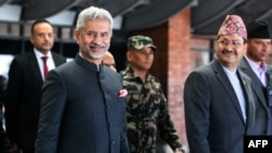 Nepal's Minister of Foreign Affairs Narayan Prakash Saud, right, welcomes his Indian counterpart Subrahmanyam Jaishankar as the latter arrives in Kathmandu, Nepal, on Jan. 4, 2024, for a meeting. Jaishankar will visit Iran this month.