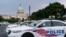 FILE - Washington Metropolitan Police Department vehicles are pictured on the perimeter of the Capitol, Aug. 26, 2021. 