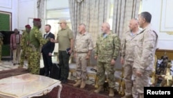 In this photo captured from video, Burkina Faso junta leader Ibrahim Traore, is seen greeting Russian military delegation led by Russian Deputy Defense Minister, Yunus-Bek Yevkurov in Ouagadougou on Thursday, August 31, 2023.