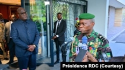 FILE - Gabon's military leader, General Brice Clotaire Oligui Nguema, right, speaks after his meeting with Democratic Republic of the Congo President Felix Tshisekedi, in Kinshasa, Oct. 11, 2023. (DRC Presidency)