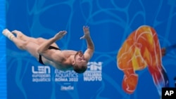 FILE - Stanislav Oliferchyk of Ukraine competes during Men's diving 1m springboard final at the European swimming championships, in Rome, Aug. 18, 2022.