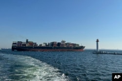 The Hong-Kong-flagged container ship Joseph Schulte leaves the port of Odesa to proceed through the temporary corridor established for merchant vessels from Ukraine's Black Sea ports in Odesa, Aug. 16, 2023.