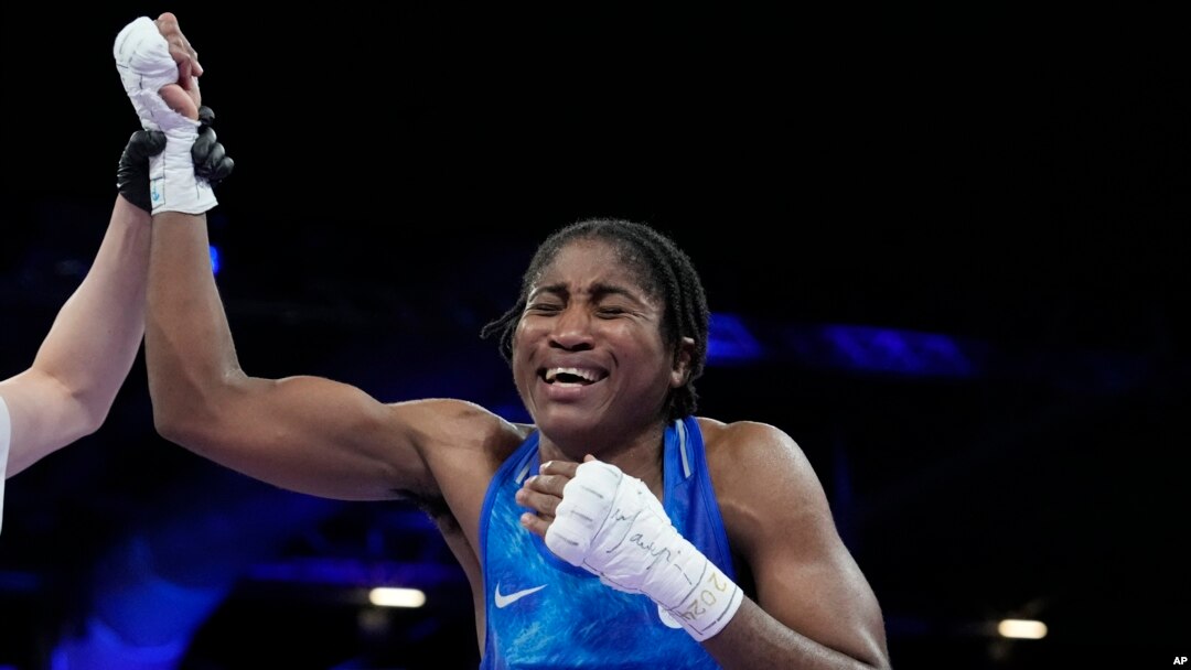 Refugee Olympic Team's Cindy Ngamba celebrates after defeating Canada's Tammara Thibeault in the women's 75 kg preliminary boxing match at the 2024 Summer Olympics, in Paris, France, July 31, 2024.