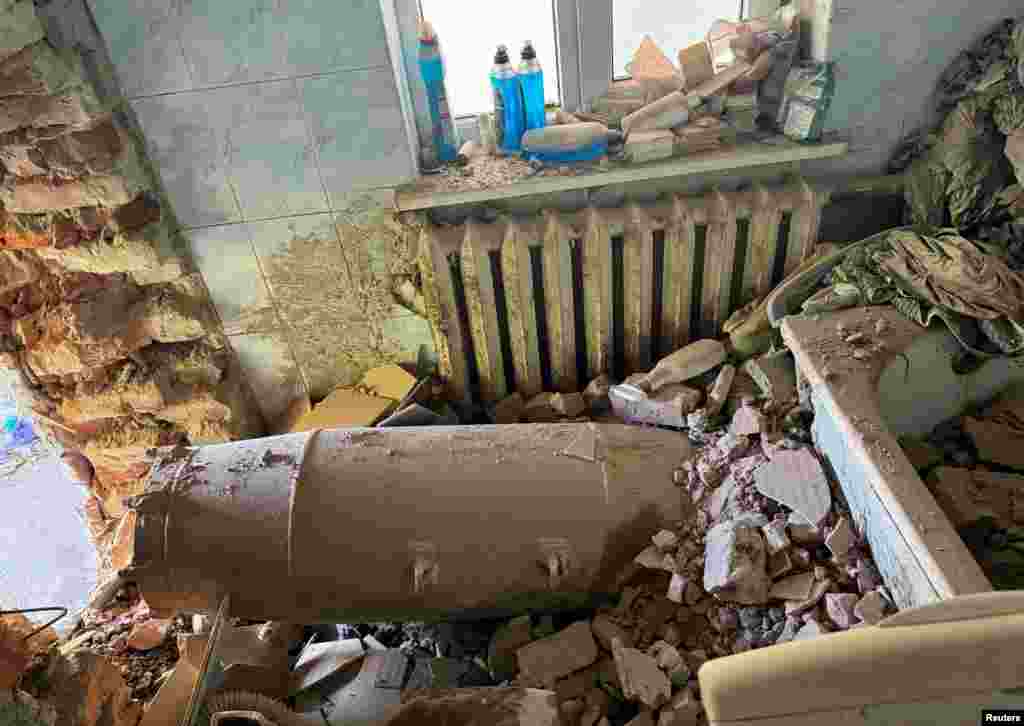 A Russian glide bomb is seen in a private house hit by a Russian air strike in Kharkiv, Ukraine.