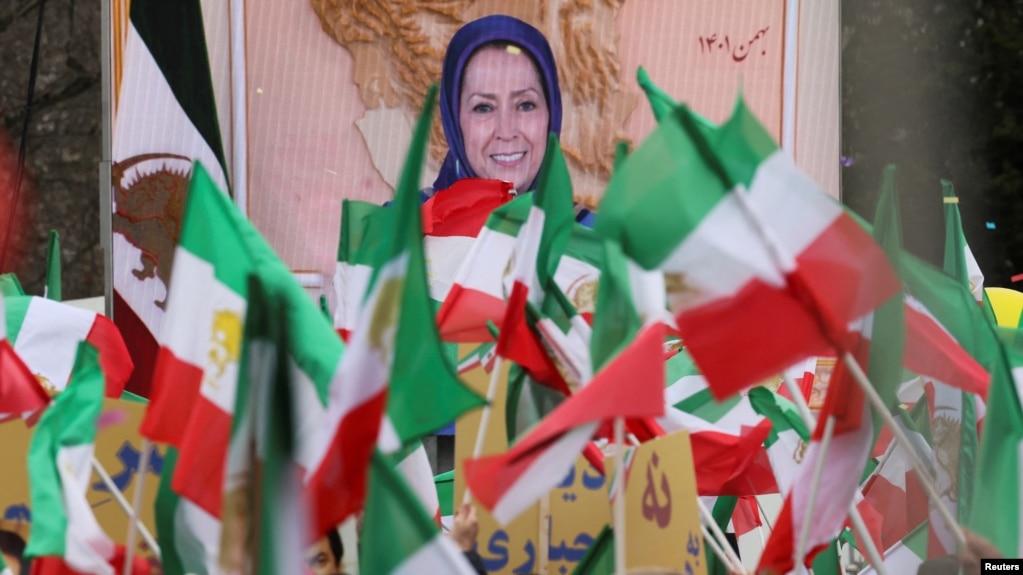 FILE - Iranian community members and supporters of the National Council of Resistance of Iran, or NCRI, take part in a protest in solidarity with Iranian people, in Paris, France, Feb. 12, 2023. France has banned an upcoming NCRI rally over safety concerns.