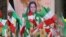 FILE - Iranian community members and supporters of the National Council of Resistance of Iran, or NCRI, take part in a protest in solidarity with Iranian people, in Paris, France, Feb. 12, 2023. France has banned an upcoming NCRI rally over safety concerns.