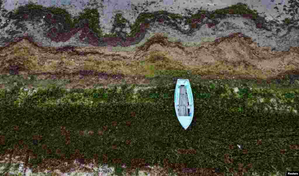 A row boat rests at a point where the water line was last year at Prespa Lake in the village of Stenje, North Macedonia.&nbsp;Water levels at Prespa Lake, located in North Macedonia, Greece and Albania are at their lowest point in centuries following dry seasons.