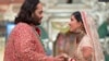 In this photo provided by Reliance Industries, Anant Ambani, son of billionaire Mukesh Ambani, holds hands with Radhika Merchant during their wedding ceremony at Jio World Convention Centre in Mumbai, India, July 12, 2024. 